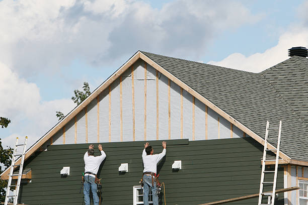 Professional Siding technician working in Highland, IL